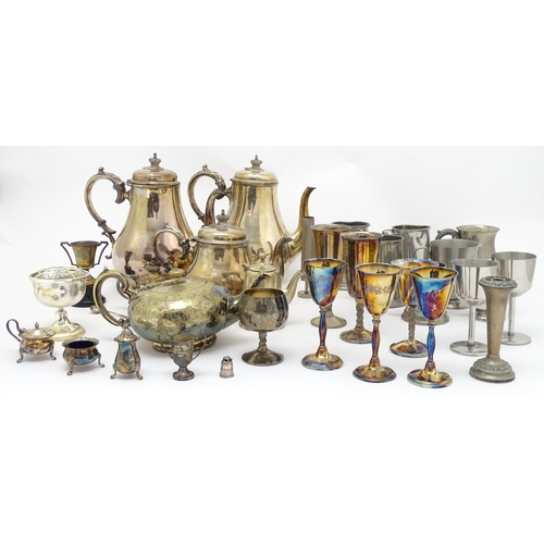 528 - A quantity of assorted silver plate, pewter and base metal wares to include goblets, tankards, cruet... 