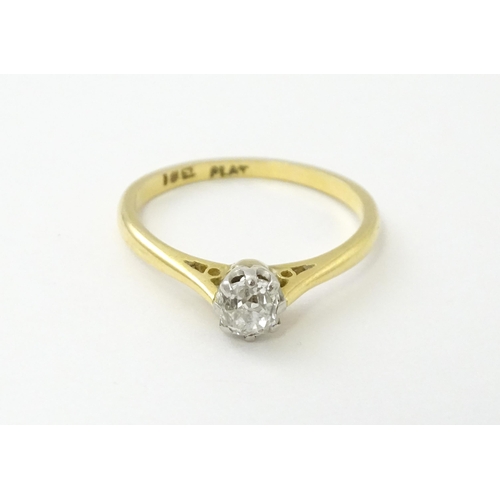 540 - An 18ct gold diamond solitaire ring set in platinum. Ring size approx. N