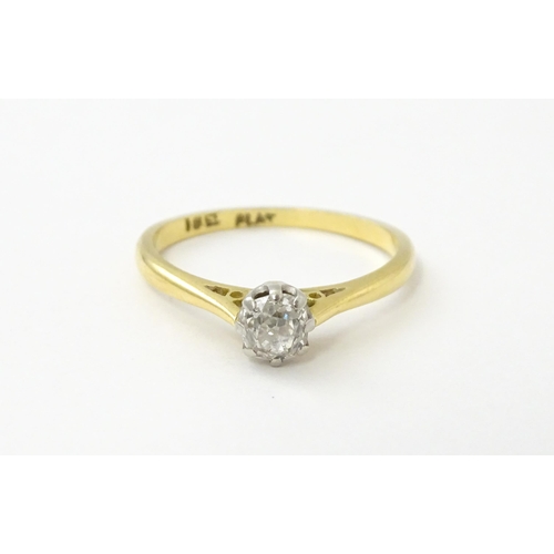 540 - An 18ct gold diamond solitaire ring set in platinum. Ring size approx. N