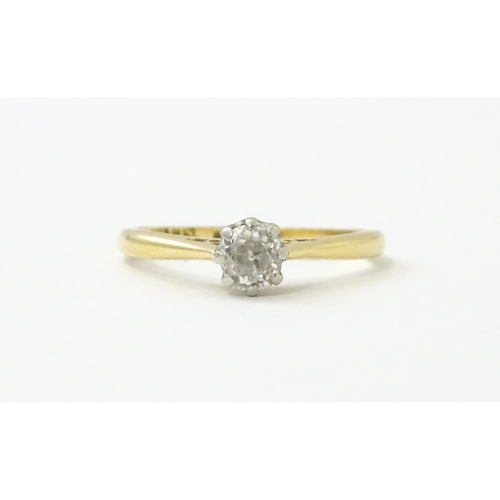 540 - An 18ct gold diamond solitaire ring set in platinum. Ring size approx. N