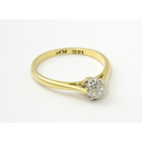 540 - An 18ct gold diamond solitaire ring set in platinum. Ring size approx. N