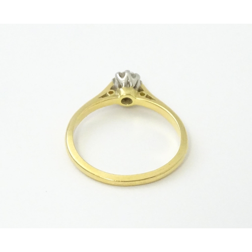 540 - An 18ct gold diamond solitaire ring set in platinum. Ring size approx. N