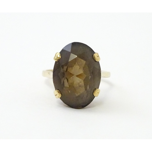 577 - A 9ct gold ring set with Smoky Quartz. Approx N 1/2