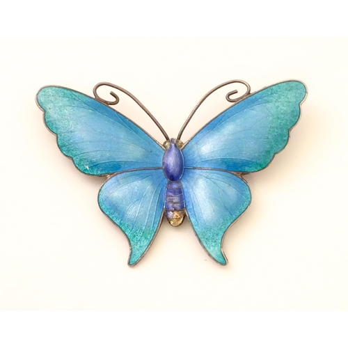 586 - A white metal brooch of butterfly form with guilloche enamel decoration, maker John Atkins & Sons. N... 