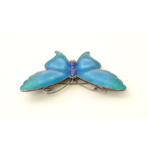 586 - A white metal brooch of butterfly form with guilloche enamel decoration, maker John Atkins & Sons. N... 