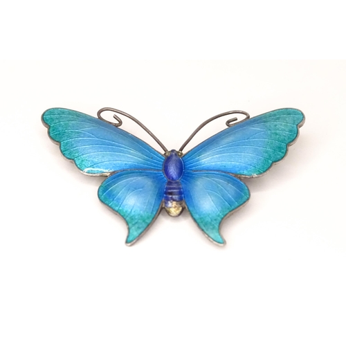 586 - A white metal brooch of butterfly form with guilloche enamel decoration, maker John Atkins & Sons. N... 