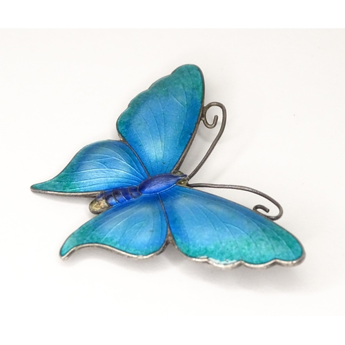 586 - A white metal brooch of butterfly form with guilloche enamel decoration, maker John Atkins & Sons. N... 