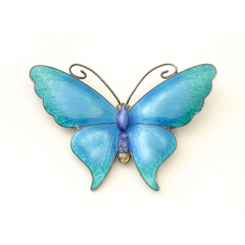 586 - A white metal brooch of butterfly form with guilloche enamel decoration, maker John Atkins & Sons. N... 