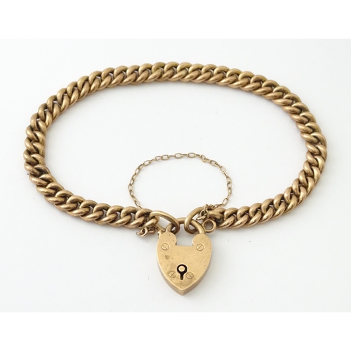 592 - A 9ct rose gold bracelet with padlock formed clasp. Approx. 7 3/4