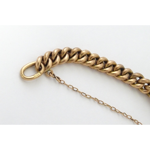 592 - A 9ct rose gold bracelet with padlock formed clasp. Approx. 7 3/4