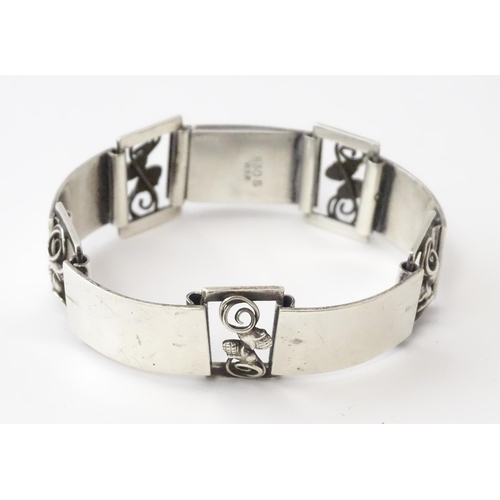 596 - A Scandinavian .830 silver bracelet with scrolling acorn style detail, and stamped W. K R for Danish... 