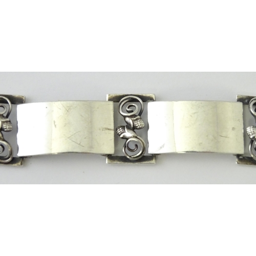 596 - A Scandinavian .830 silver bracelet with scrolling acorn style detail, and stamped W. K R for Danish... 