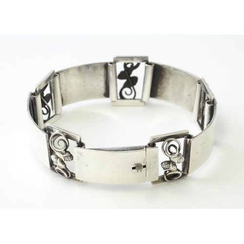 596 - A Scandinavian .830 silver bracelet with scrolling acorn style detail, and stamped W. K R for Danish... 