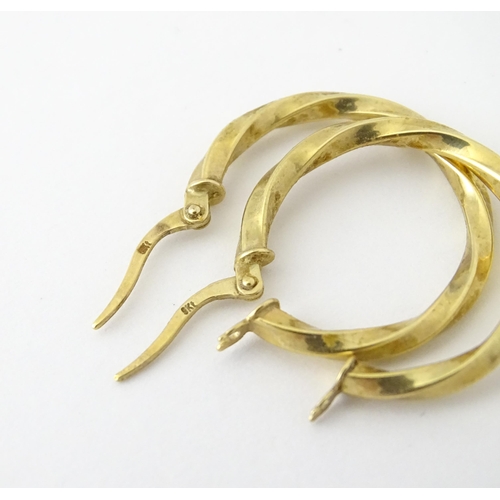 599 - A pair of 9ct gold hoop earrings. Approx. 1