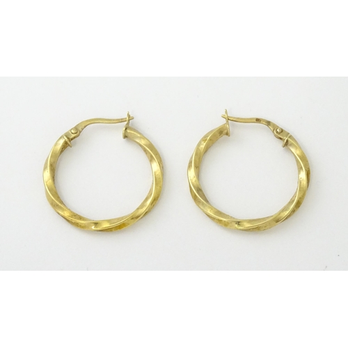 599 - A pair of 9ct gold hoop earrings. Approx. 1