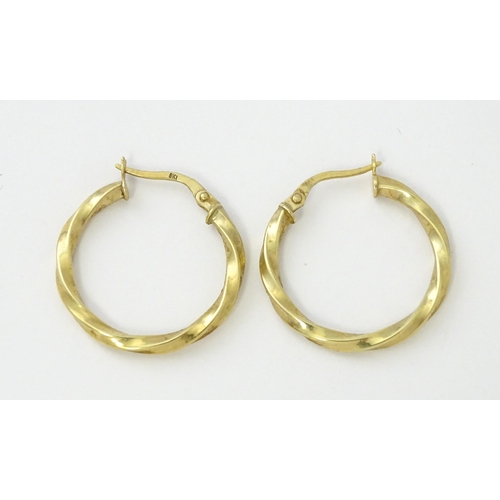 599 - A pair of 9ct gold hoop earrings. Approx. 1