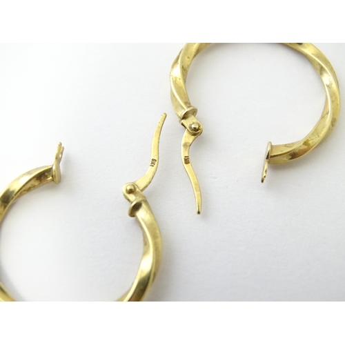 599 - A pair of 9ct gold hoop earrings. Approx. 1