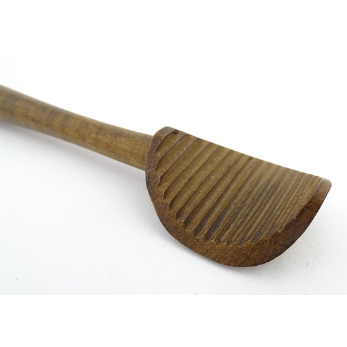 1159 - Treen : Two 19thC sycamore butter curlers having ribbed blades, one with carved foliate detail to ha... 