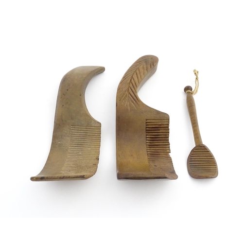 1159 - Treen : Two 19thC sycamore butter curlers having ribbed blades, one with carved foliate detail to ha... 