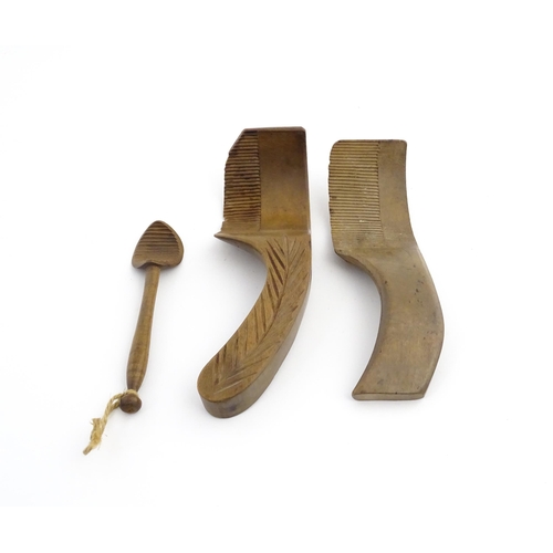 1159 - Treen : Two 19thC sycamore butter curlers having ribbed blades, one with carved foliate detail to ha... 