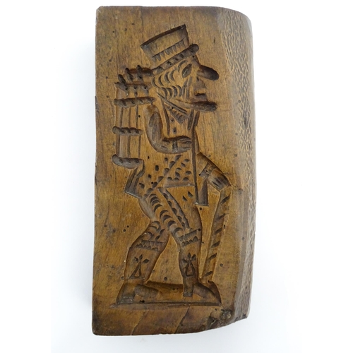 1160 - Treen : A 19thC double sided sycamore gingerbread biscuit / cookie mould with Mr Punch detail to one... 