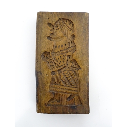 1160 - Treen : A 19thC double sided sycamore gingerbread biscuit / cookie mould with Mr Punch detail to one... 