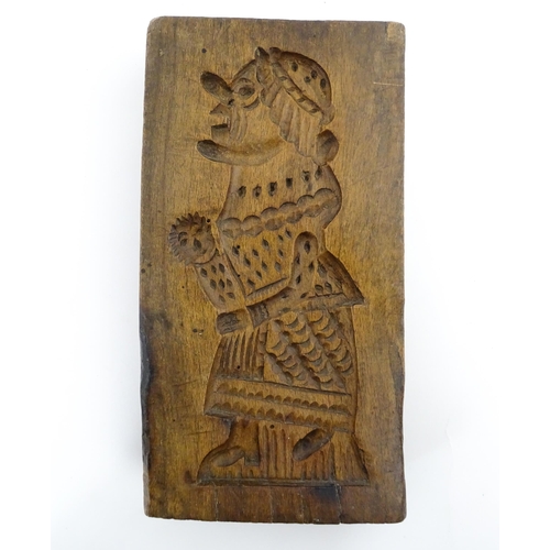 1160 - Treen : A 19thC double sided sycamore gingerbread biscuit / cookie mould with Mr Punch detail to one... 