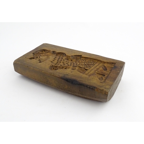 1160 - Treen : A 19thC double sided sycamore gingerbread biscuit / cookie mould with Mr Punch detail to one... 