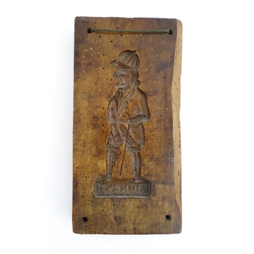 1162 - Treen : A 19thC sycamore gingerbread biscuit / cookie mould with carved figural decoration titled Ad... 