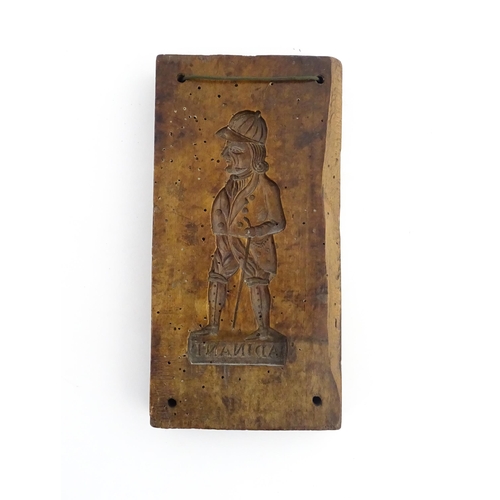 1162 - Treen : A 19thC sycamore gingerbread biscuit / cookie mould with carved figural decoration titled Ad... 