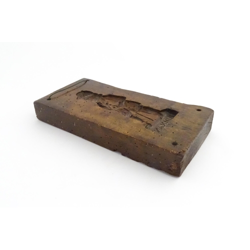 1162 - Treen : A 19thC sycamore gingerbread biscuit / cookie mould with carved figural decoration titled Ad... 