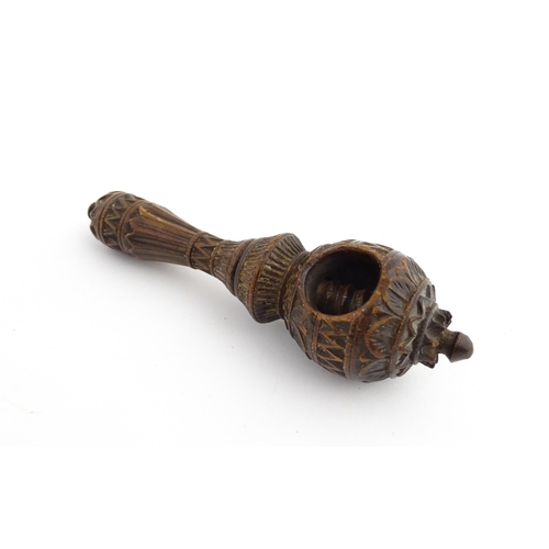 1167 - Treen : A 19thC nutcracker with chip carved decoration, with carved initials R.I.G. to reverse. Appr... 