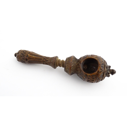 1167 - Treen : A 19thC nutcracker with chip carved decoration, with carved initials R.I.G. to reverse. Appr... 