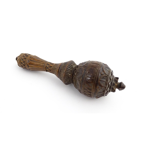 1167 - Treen : A 19thC nutcracker with chip carved decoration, with carved initials R.I.G. to reverse. Appr... 