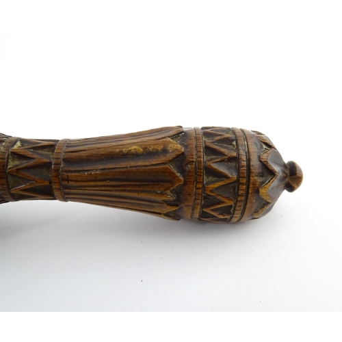 1167 - Treen : A 19thC nutcracker with chip carved decoration, with carved initials R.I.G. to reverse. Appr... 