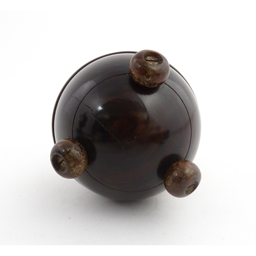 1168 - Treen : A 19thC lignum vitae string box of circular form raised on three feet. Approx. 3