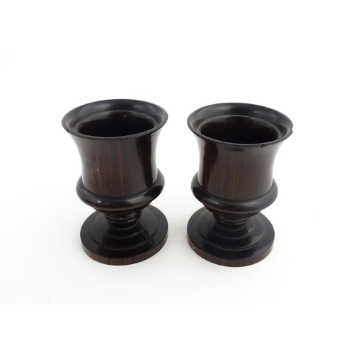 1170 - Treen : A pair of 19thC turned rosewood pedestal salts. Approx. 3