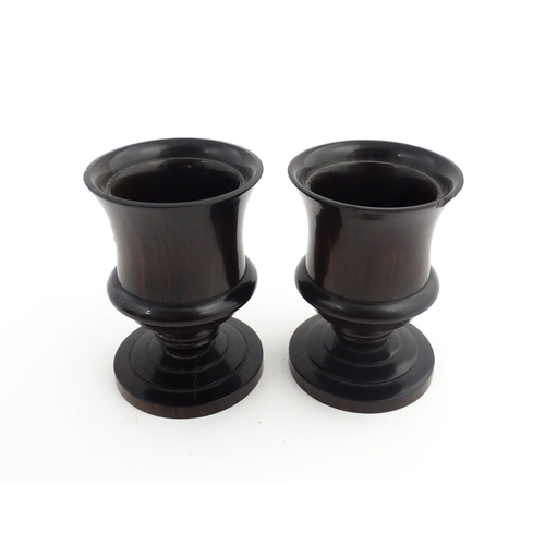 1170 - Treen : A pair of 19thC turned rosewood pedestal salts. Approx. 3