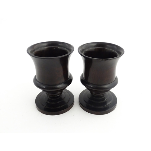 1170 - Treen : A pair of 19thC turned rosewood pedestal salts. Approx. 3