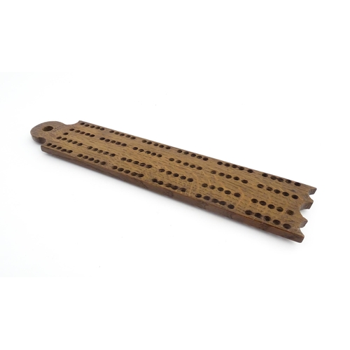 1171 - Treen : A 19thC oak cribbage board. Approx. 13 1/4