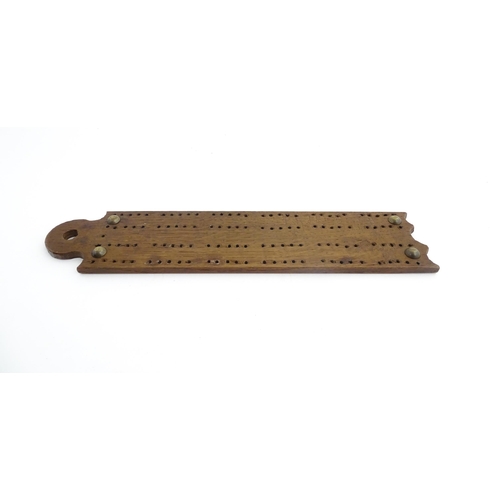 1171 - Treen : A 19thC oak cribbage board. Approx. 13 1/4