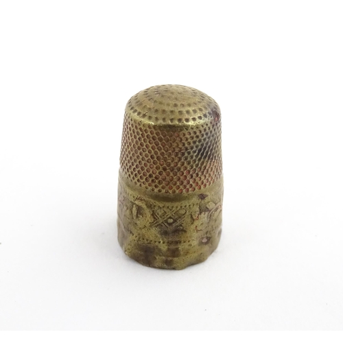 1173 - Treen : A small 19thC treen container with banded detail. Together with a small brass thimble. Pot a... 