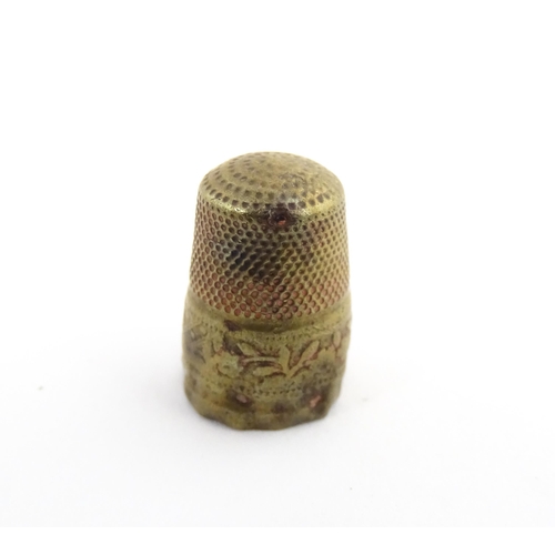 1173 - Treen : A small 19thC treen container with banded detail. Together with a small brass thimble. Pot a... 