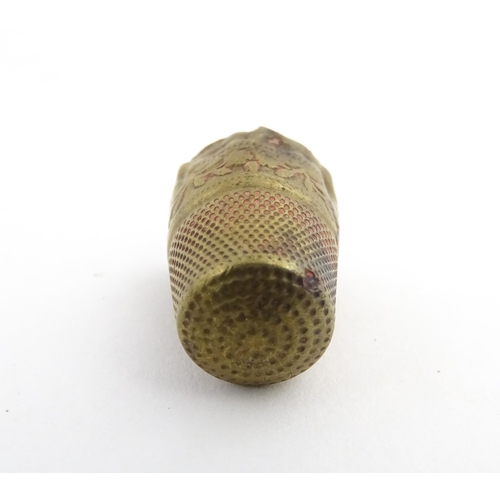 1173 - Treen : A small 19thC treen container with banded detail. Together with a small brass thimble. Pot a... 