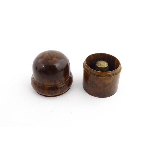 1173 - Treen : A small 19thC treen container with banded detail. Together with a small brass thimble. Pot a... 