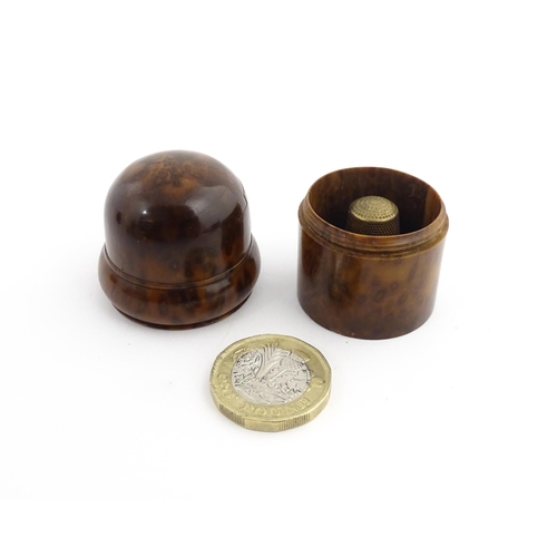 1173 - Treen : A small 19thC treen container with banded detail. Together with a small brass thimble. Pot a... 