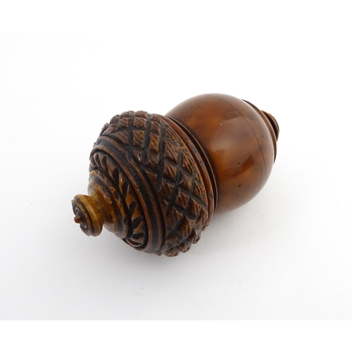 1176 - Treen : A 19thC carved coquilla nut nutmeg grater modelled as an acorn. Approx. 3