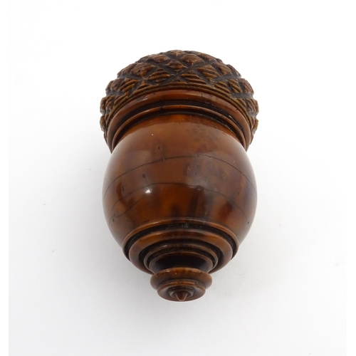 1176 - Treen : A 19thC carved coquilla nut nutmeg grater modelled as an acorn. Approx. 3