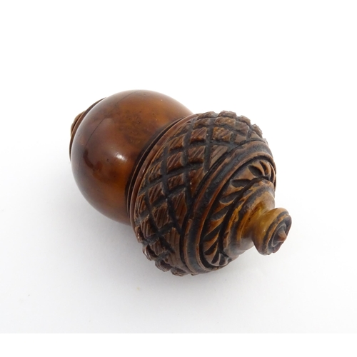 1176 - Treen : A 19thC carved coquilla nut nutmeg grater modelled as an acorn. Approx. 3