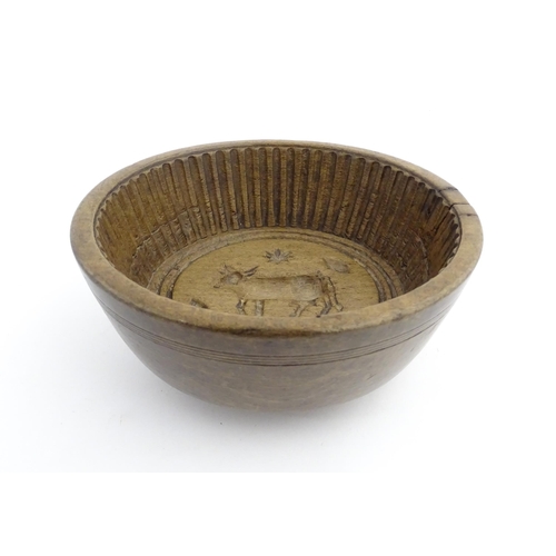 1180 - Treen : A 19thC sycamore flummery / pudding bowl / mould of circular form, having an interior with v... 